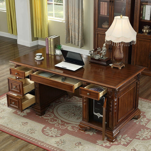 Hand-carved solid wood executive desk with raised front panels and claw foot legs front view
